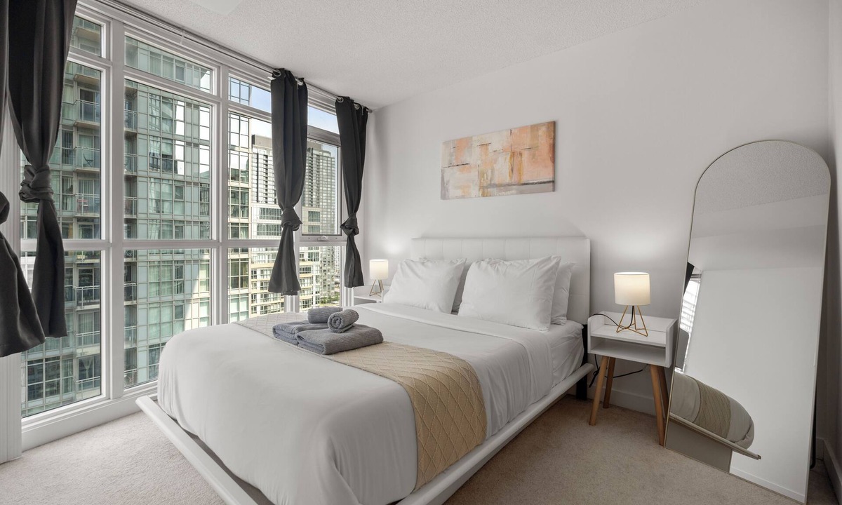 CityPlace Condo | 2BD 1 Bath 4 Guests Parking Balcony Near CN Tower Downtown—By Hostia