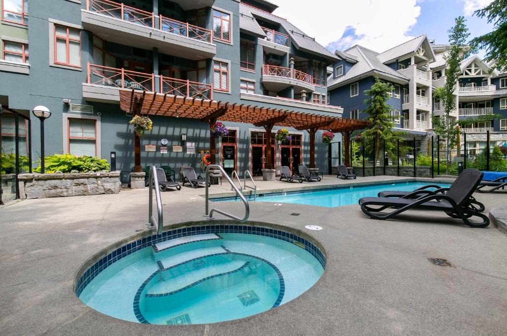 Village North Apartment | Beautiful Whistler Village Alpenglow suite queen size bed air conditioning cable and smartTV WIFI fireplace pool hot tub sauna gym balcony mountain views
