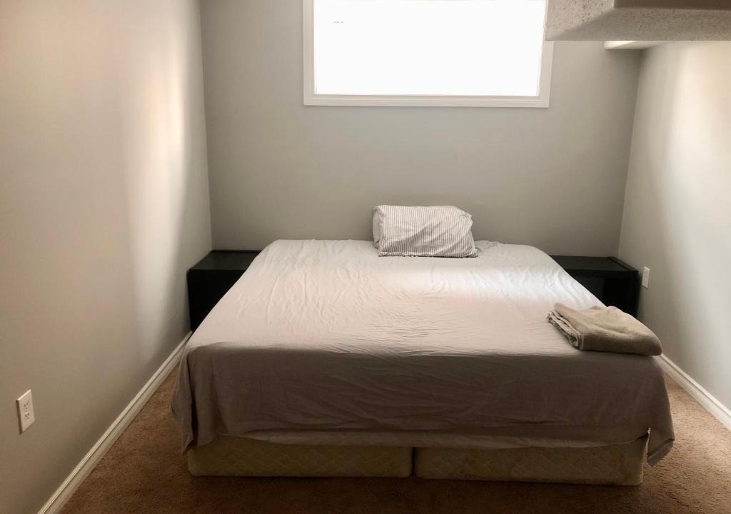 Chestermere House | Chestermere room with King sized bed