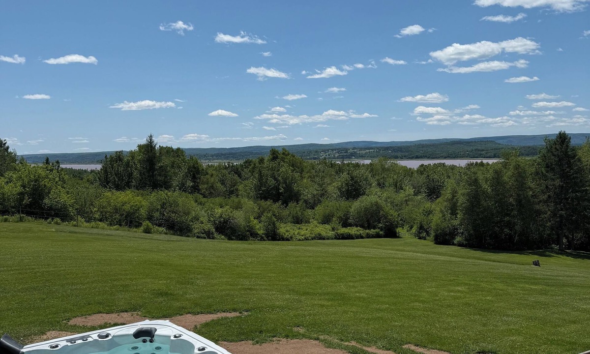 Memramcook House | Muddy River Retreat - Private backyard with Hot tub