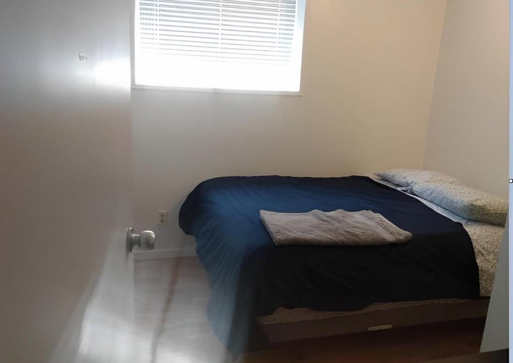 Calgary House | Private bedroom in basement suite - Pineland