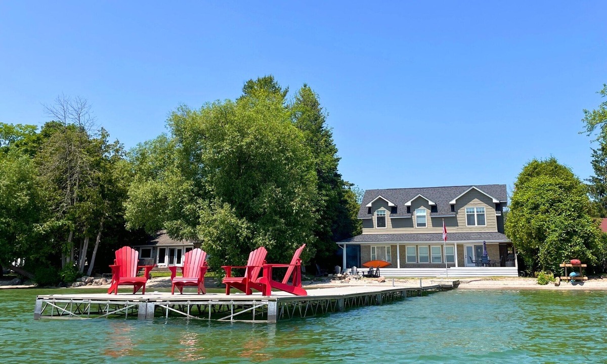 Big Bay Point Cottage | Shallow Beach Lakefront Cottage perfect with Kayak, Firepit, BBQ + Playground