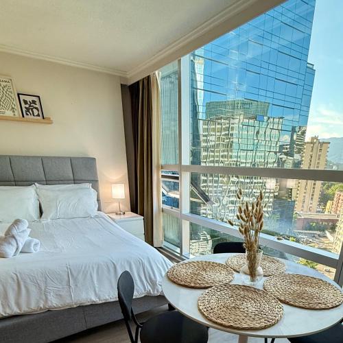 Downtown Vancouver Apartment | Stunning Skyline Views in a Cozy and Stylish Abode