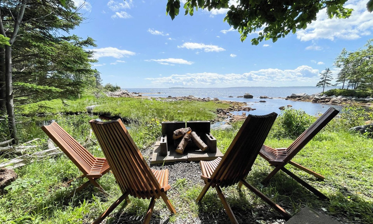 East River Point House | The oceanside Hideaway is nestled between the trees with stunning ocean views