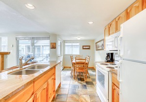 Ideal first-floor getaway with hot tub, fireplace, & balcony - walk to lifts