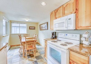 Ideal first-floor getaway with hot tub, fireplace, & balcony - walk to lifts