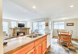 Ideal first-floor getaway with hot tub, fireplace, & balcony - walk to lifts