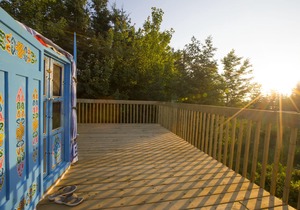 Large sky blue yurt at Cabot Shores Wilderness Resort