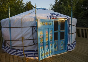 Large sky blue yurt at Cabot Shores Wilderness Resort