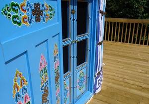 Large sky blue yurt at Cabot Shores Wilderness Resort