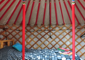 Small red yurt at Cabot Shores Wilderness Resort