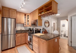 Updated, bright & cozy corner unit with private bike/ski storage and free parking