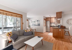 Updated, bright & cozy corner unit with private bike/ski storage and free parking