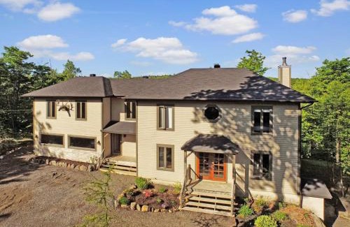 Morin Heights Ski Chalet | Blue Hill Pool spa game room mountain view