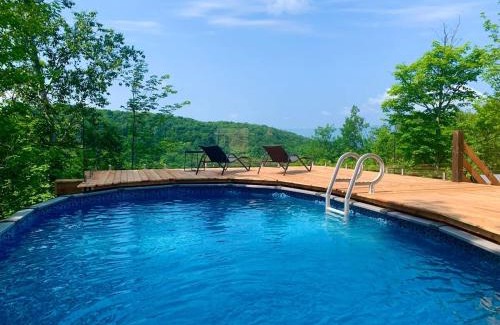 Morin Heights Ski Chalet | Blue Hill Pool spa game room mountain view