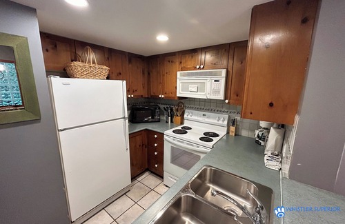 Village North Condo | Cozy Ground Floor, Free Parking, Pool and Hot Tub, Deck