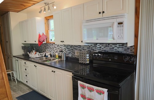 East Dalhousie Cottage | Lake front cottage with beach & dock (Pet-Friendly!)