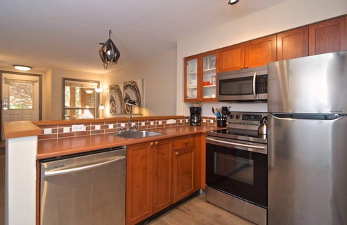 Village North House | Modern quiet townhome with private HOT TUB, GAS fireplace, common Pool and hot tub.