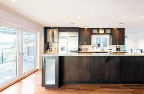 District of North Vancouver House | Stunning Waterfront Deep Cove Home w/Private Dock