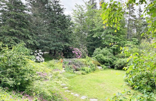 East River Point House | The oceanside Hideaway is nestled between the trees with stunning ocean views