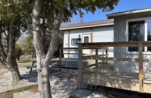 Stokes Bay RV Rental | #0 Enjoy a waterfront view from your own trailer with a deck & sunroom