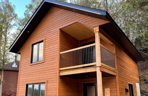 Bowman Ski Chalet | [# 2 The Dog] Cottage on the banks of the river.