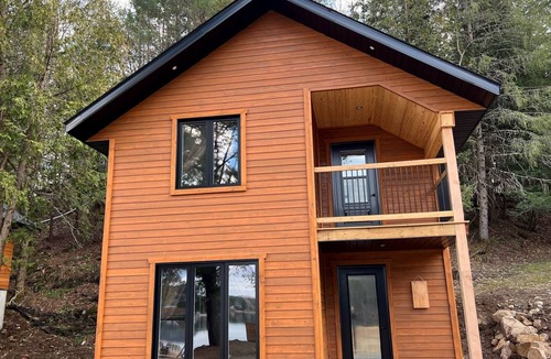 Bowman Ski Chalet | [# 4 The Raven] Chalet on the banks of the river.