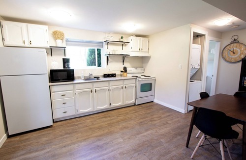 Departure Bay Apartment | A bright and cozy 1-bedroom basement suite is nestled in a lush garden setting
