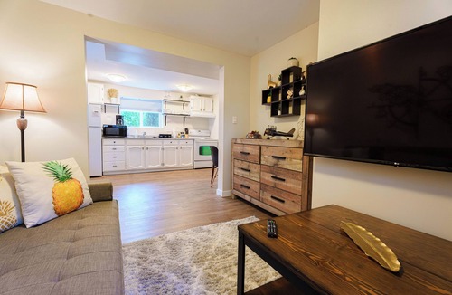 Departure Bay Apartment | A bright and cozy 1-bedroom basement suite is nestled in a lush garden setting