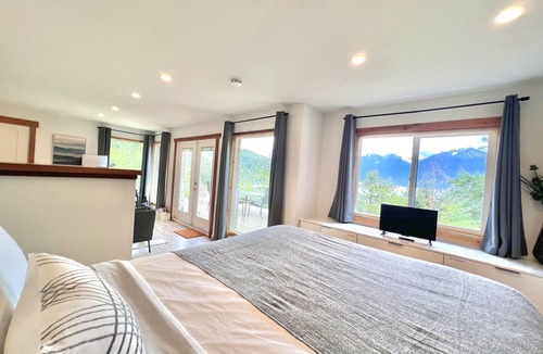Bowen Island Bed & Breakfast | A cozy guest suite with a panoramic ocean view facing the Howe Sound Mountain
