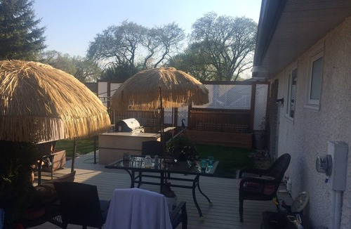 St. Vital House | Backyard oasis awaits. Enjoy your stay.
