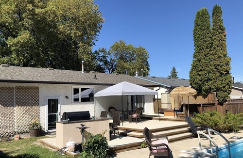St. Vital House | Backyard oasis awaits. Enjoy your stay.