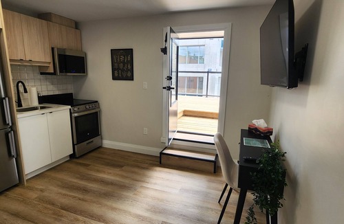 Kitchener Apartment | Balcony Studio Unit Queen Bed overlooking the city in Prime Downtown Location