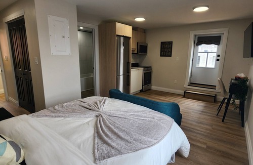 Kitchener Apartment | Balcony Studio Unit Queen Bed overlooking the city in Prime Downtown Location