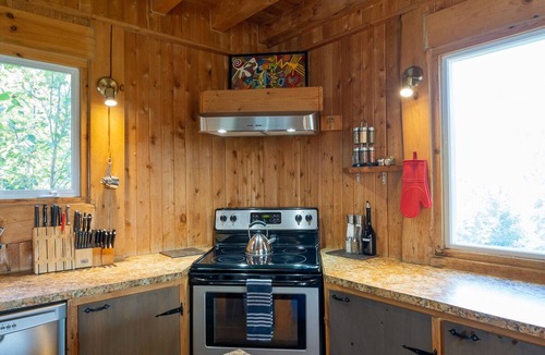 Saint Donat Ski Chalet | Beautiful rustic chalet with a tower and spectacular view. A spa and veranda open all year round.
