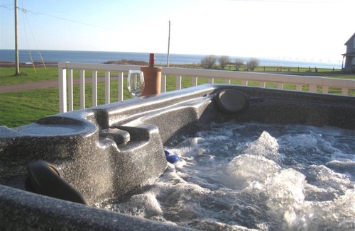 Borden-Carleton House | Beach Paradise! Unmatchable Sunsets, Hot Tub, Luxurious Ocean View, A/C, & more!