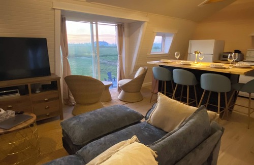 Cape Saint Marys Apartment | Bright and Airy Ocean View Loft. A few minutes walk to Mavillette beach.