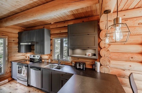 Petite-Riviere-Saint-Francois Ski Chalet | Chalet Bois Rond 10: River Views, Terrace & Spa
