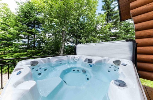 Petite-Riviere-Saint-Francois Ski Chalet | Chalet Bois Rond 10: River Views, Terrace & Spa