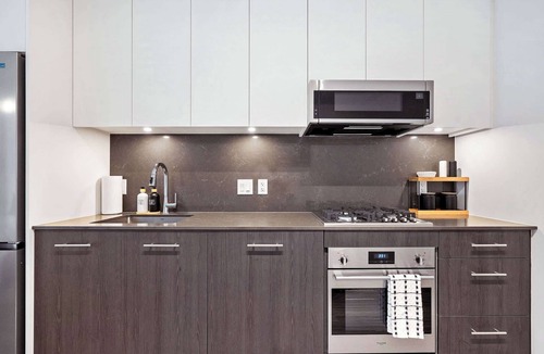 Eau Claire Apartment | Central Calgary Riverside Haven