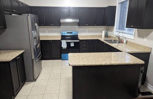 Alcona House | Cheerful 4 Bedroom house with indoor fireplace
