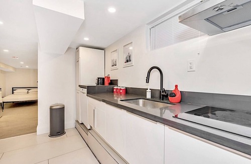 East Danforth House | Clean, white, bright and close to Woodbine subway
