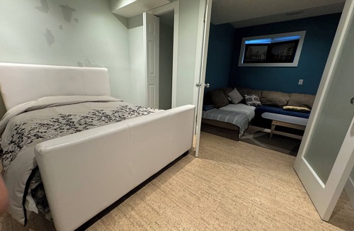 East Village House | close to stampede, private room and bathroom in the basement, a small living