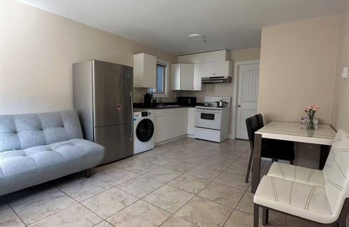 Marpole House | Cozy 1-BR Suite in West Side Kitchen & Living