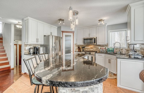 Shawnessy House | Cozy Family Friendly Home with Rec Room & Sauna!