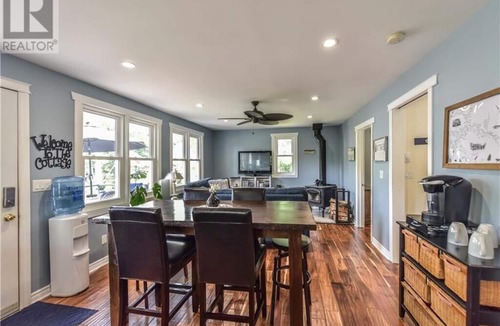 Severn Cottage | Cozy Lakeside Cottage Retreat with Kayaks, Paddle Boat & Sunset Waterfront Views