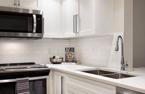 Village North Hotel | Designer Condo close to lifts. Large pool & hot tub, free wifi & secure parking