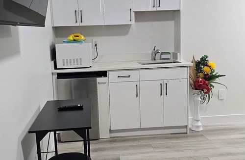 Saskatoon Apartment | "Discover Dominion's Crib! This chic and cozy space is ideal for travelers.