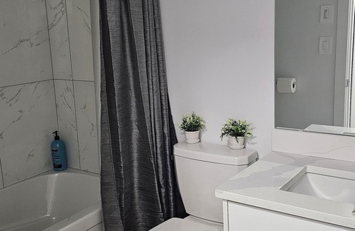 Saskatoon Apartment | "Discover Dominion's Crib! This chic and cozy space is ideal for travelers.