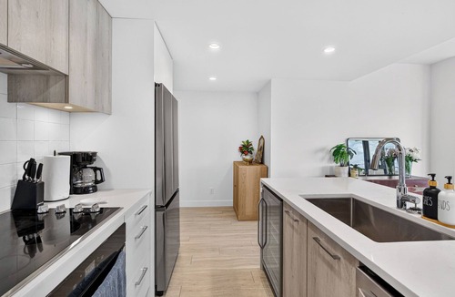 South Pandosy Apartment | Experience luxury waterfront living at Aqua Waterfront Village. This stylish 2BR, 2BA condo features designer interiors, two queen bedrooms, a spacious covered patio, chef's kitchen, and resort-style amenities just steps from Okanagan Lake.